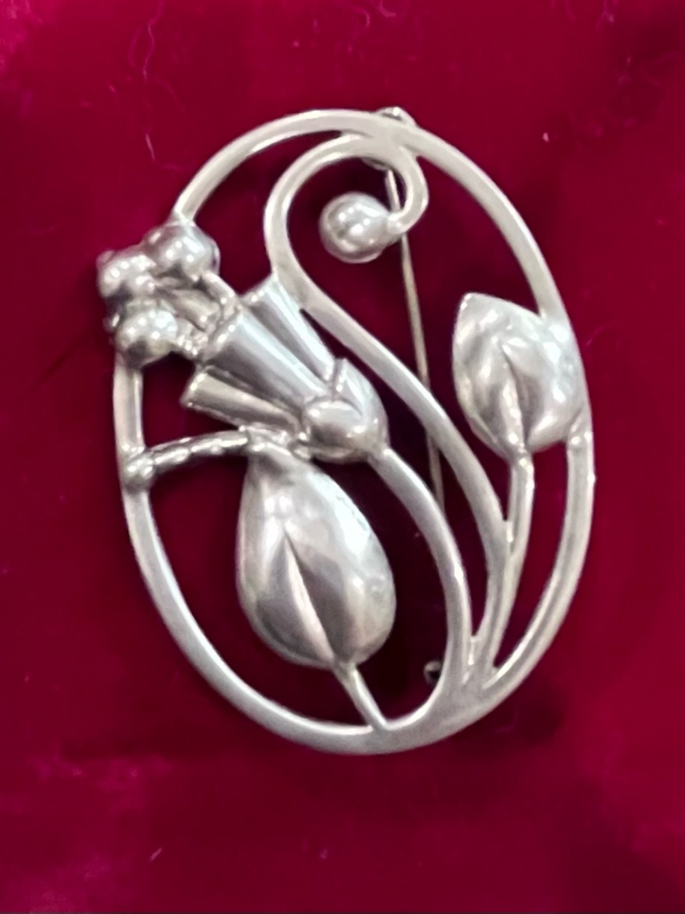 Elegant sterling silver oval floral brooch in Art Nouveau style from late 1800s